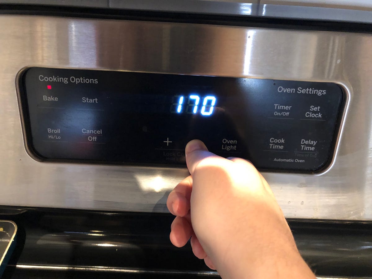 Setting oven temperature to 170 degrees Fahrenheit.