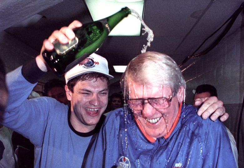 Esa Tikkanen is seen dousing then-Edmonton Oilers coach John Muckler with champagne in the aftermath of the team's fifth Stanley Cup victory in May of 1990.