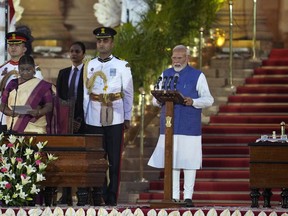 Narendra Modi, right, is sworn-in as the Prime Minister of India by President Draupadi Murmu, left, at the Rashtrapati Bhawan, in New Delhi, India, Sunday, June 9, 2024. The 73-year-old leader is only the second Indian prime minister to retain power for a third term.