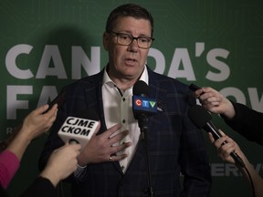 Premier Scott Moe answers questions from the press after his State of Agriculture speech at Canada's Farm Show inside the Viterra International Trade Centre on Tuesday, June 18, 2024 in Regina.