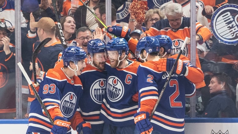 Hockey players celebrate.