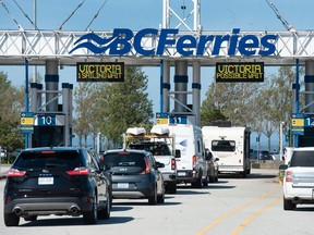 Passengers waiting to board a ferry at the Tsawwassen ferry terminal Saturday, July 1, 2023 after a ferry was taken out of service because of mechanical issues.