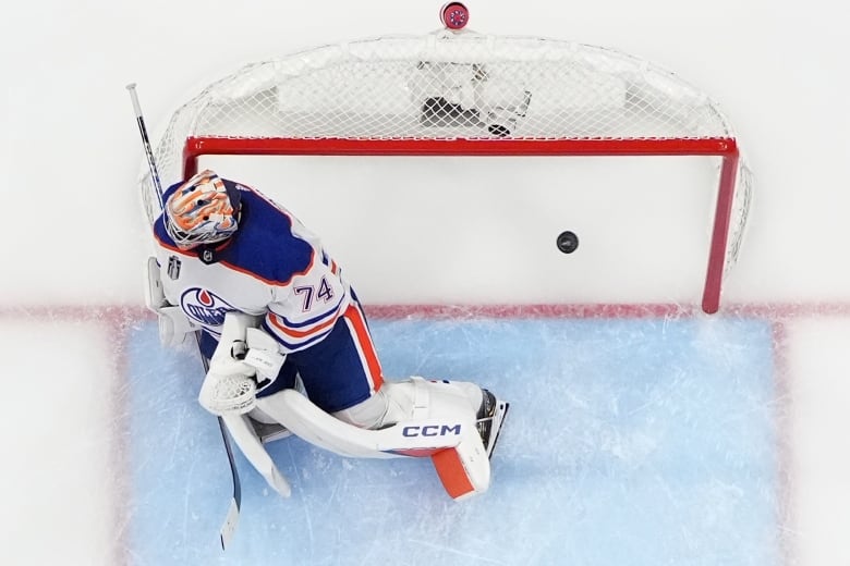 A puck shot by Florida Panthers centre Evan Rodirgues is seen getting past Edmonton Oilers goalie Stuart Skinner during the first game of the Stanley Cup Finals last Saturday. The Oilers lost the series opener to the Panthers 3-0.