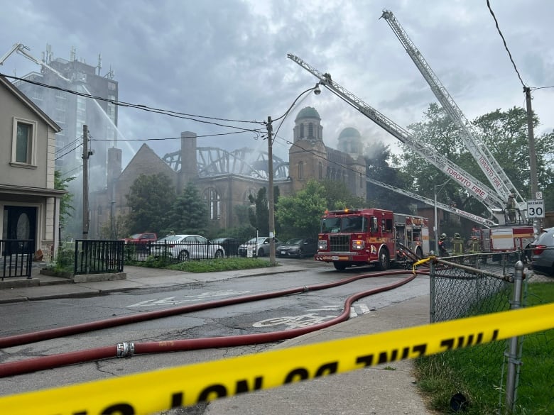 A church seen after fire ravages much of its dome. 