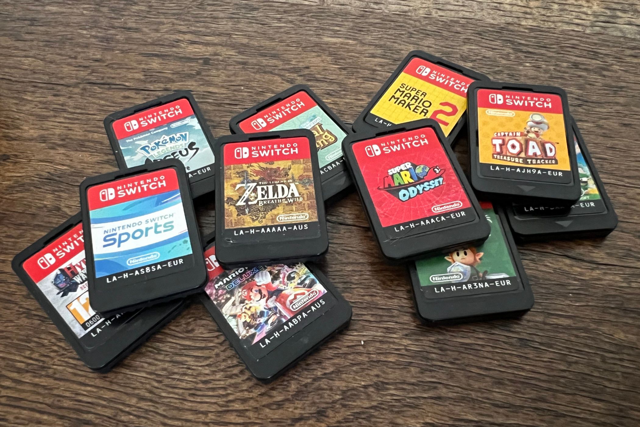 Nintendo Switch game cartridges on a table.